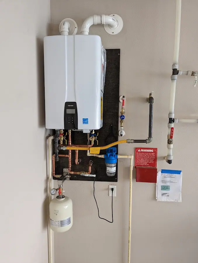 Professional plumber installing copper piping in a Loyalsock home